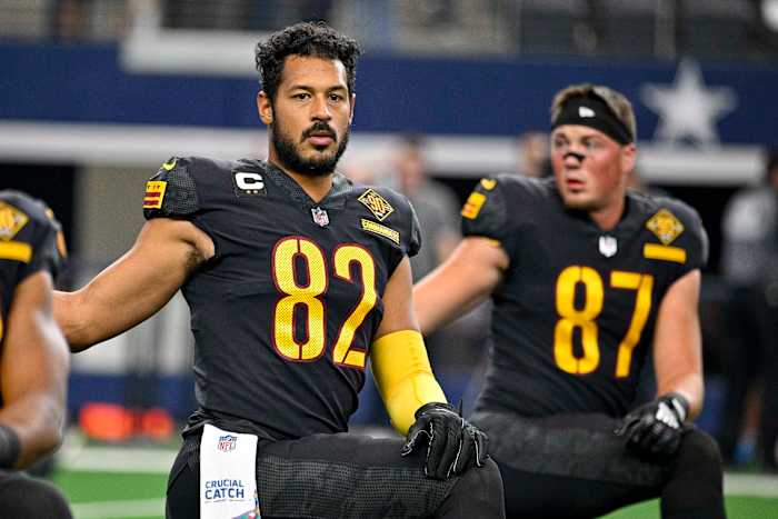 Washington Commanders tight ends Logan Thomas (82) and John Bates (87) prepare for a game against the Dallas Cowboys.